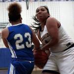 Luciano Marano | Bainbridge Island Review - Spartan sophomore Malia Peato grapples for the ball during Wednesday nights home game against Ingraham, the last home game of the regular season for the Bainbridge High varsity girls basketball team.