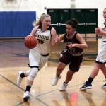 Luciano Marano | Bainbridge Island Review - Spartan freshman Anna Kozlosky drives toward the hoop during Tuesdays home game.