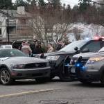 Police stand at the scene of an officer-involved shooting Feb. 7 in downtown Winslow. (Luciano Marano | Bainbridge Island Review)