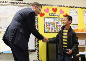 District Superintendent Peter Bang-Knudsen presents Eli Cook with a BISD Strong Award. (Photo courtesy of the Bainbridge Island School District)