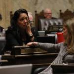 Rep. Kristine Reeves, D-Federal Way, battled tears during the House floor debate on a bill to ban bump stocks, while her colleague Tana Senn, D- Mercer Island, turned to comfort her. (Taylor McAvoy | WNPA Olympia News Bureau)