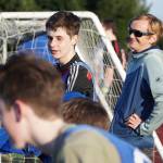 Luciano Marano | Bainbridge Island Review - Spartan varsity boys soccer team Head Coach Drew Keller laughs on the sidelines of a recent practice session.