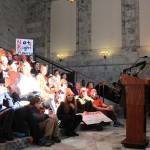 Anna Justen, a junior at Ingraham High School in Seattle, leads a chant. No more silence, the crowd chanted. End gun violence. (Taylor McAvoy | WNPA Olympia News Bureau)