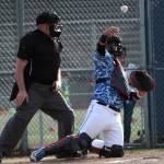 Luciano Marano | Bainbridge Island Review - Spartan sophomore catcher Luis Vales Crespo tosses the ball back to the pitcher during the Bainbridge High School varsity baseball teams first game of the year.