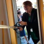 Photo courtesy of The Art Project | The Art Projects executive director Lindsay Masters performs the ceremonial ribbon cutting as the downtown Winslow gallery is reopened after being remodeled and renamed.