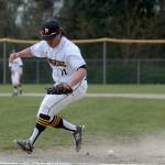 Luciano Marano | Bainbridge Island Review - Spartan senior Tad Grindeland scrambles to grab the ball, playing first base in Tuesdays home game against Franklin.