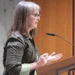 Bainbridge council candidate Leslie Schneider answers questions from the council at Tuesdays meeting. (Brian Kelly | Bainbridge Island Review)