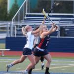 Eleanor King elevates for the draw in the Bainbridge win over Nathan Hale this week. (Lara Sweeney photo)