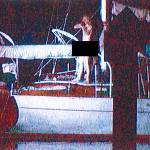 Robert D. Yeiser aims a rifle at SWAT officers from the deck of his sailboat, the Flying Gull, seconds before the end of the deadly standoff last summer in Eagle Harbor. (Image courtesy of WSP)