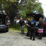 Police gather across the street from Bainbridge High School as authorities prepare to search the campus following a bomb threat Thursday. (Luciano Marano | Bainbridge Island Review)