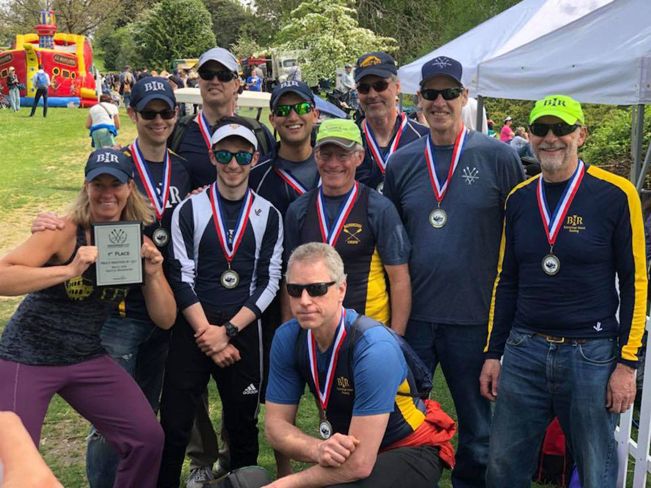 Rob Bloom photo | The Bainbridge Island Rowing Masters Mens 8+ rowers with coach Kate Berry.