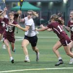 Mackenzie Chapman attacks the Mercer Island goal during first-half action in the Washington state girls lacrosse championship game. (Brian Kelly | Bainbridge Island Review)