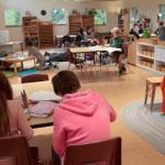 Luciano Marano | Bainbridge Island Review - Students complete assignments in one of the newly constructed buildings at the unified Arrow Point Drive campus of the Montessori Country School.