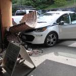 Woman unhurt after car crashes into building