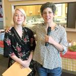 Scholarship winner Bella Fenner smiles after being handed her scholarship announcement from Jessica Dubey.