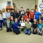 Becky Bronstein of Washington Green Schools presents the Sustaining Platinum certificate to Green Team teacher Mike Derzon and the 5th grade students. (Joan Henderson photo)