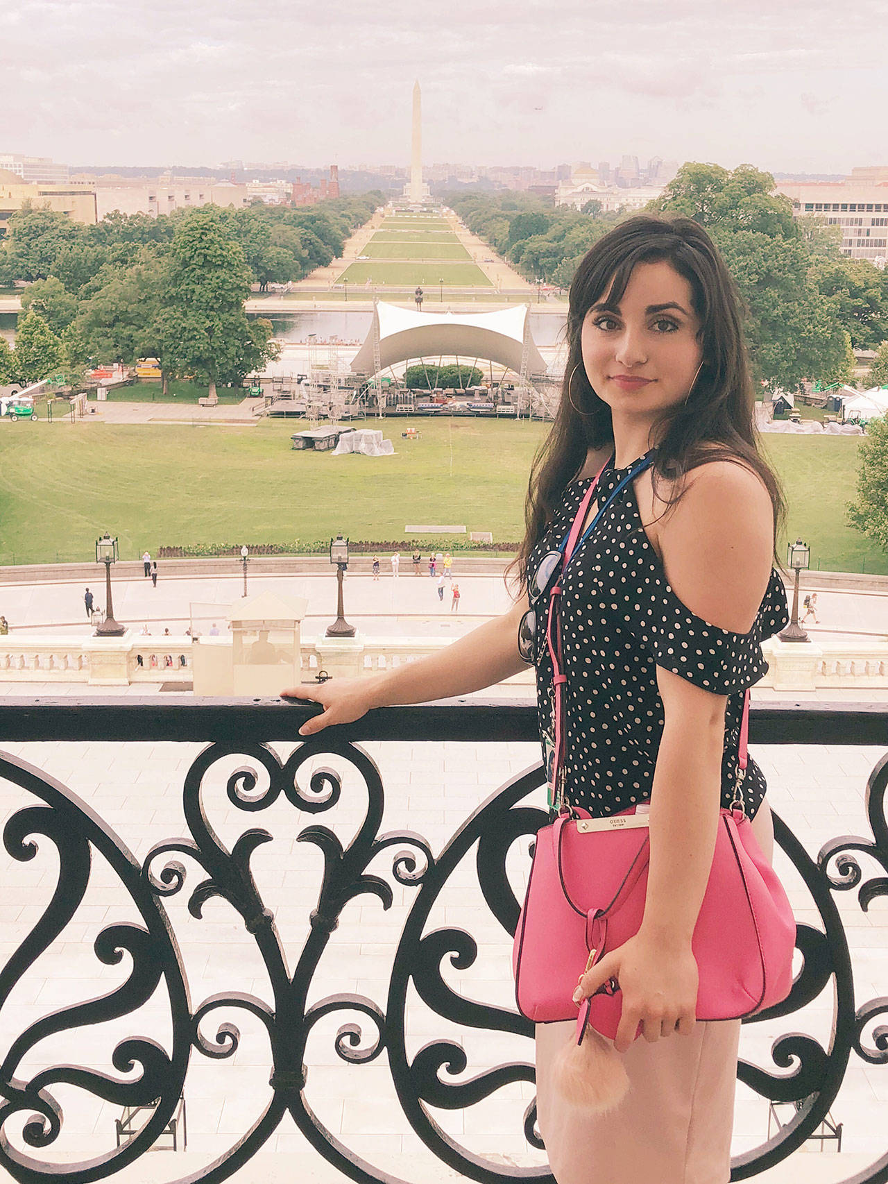 Anisa Ashabi stands for a photo on the Speakers Balcony of the U.S. Capitol Building during her internship. (Photo courtesy of Elizabeth Dourley)