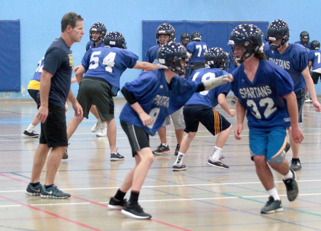 On track, indoors: BHS football squad dodges smoke to practice | Photo gallery