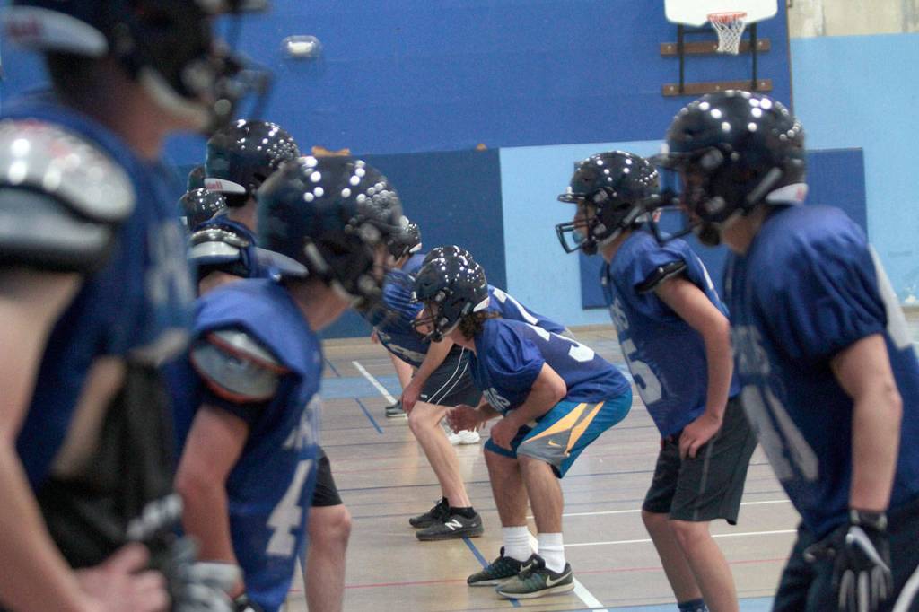 On track, indoors: BHS football squad dodges smoke to practice | Photo gallery