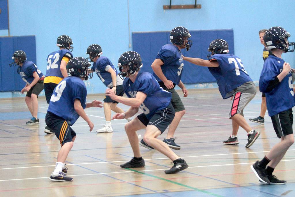 On track, indoors: BHS football squad dodges smoke to practice | Photo gallery