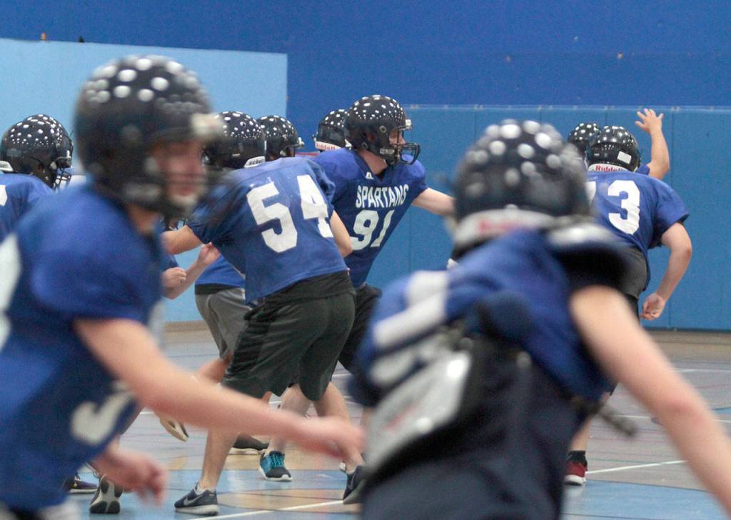 On track, indoors: BHS football squad dodges smoke to practice | Photo gallery