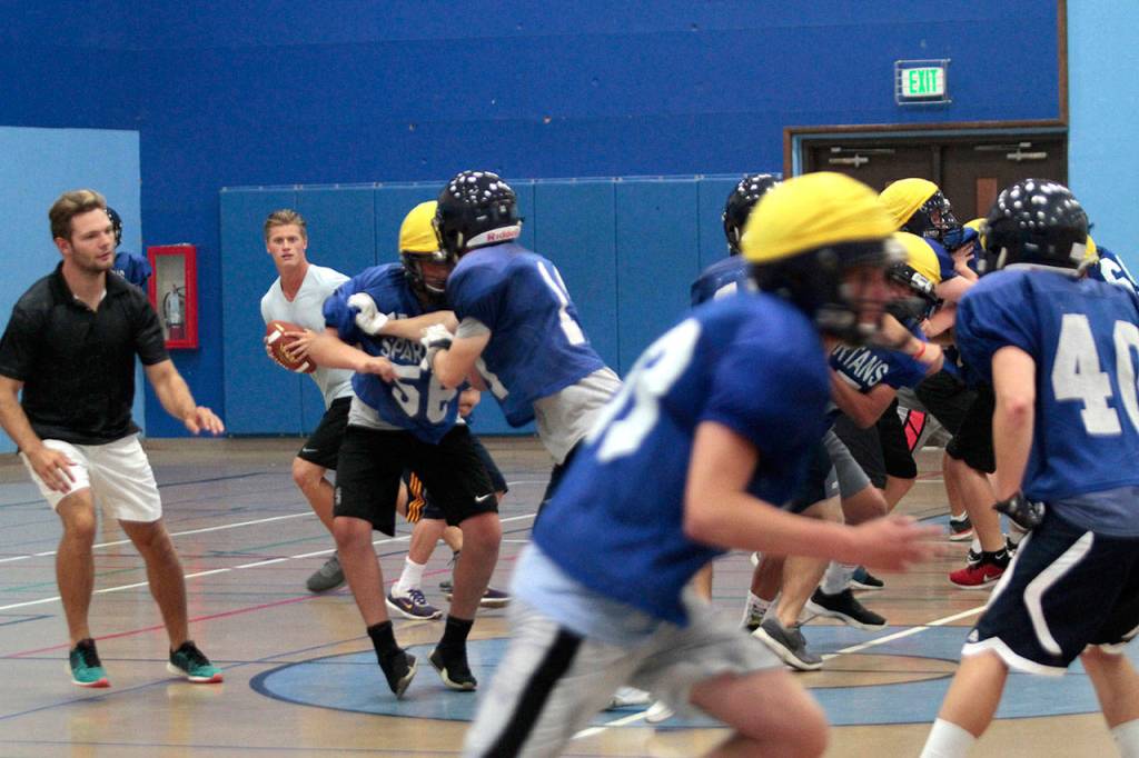 On track, indoors: BHS football squad dodges smoke to practice | Photo gallery