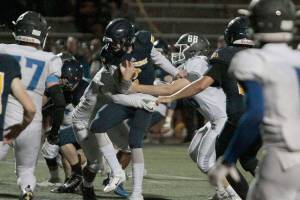 Spartans slay Trojans in year’s first home football win | Photo gallery