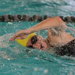 Laura Murphy swims the 100-yard freestyle against Holy Names Academy during HNAs meet against Bainbridge last week at home. (Brian Kelly | Bainbridge Island Review)