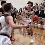 Luciano Marano | Bainbridge Island Review - Spartan co-captain Spencer Nicholas drives toward the hoop Tuesday.