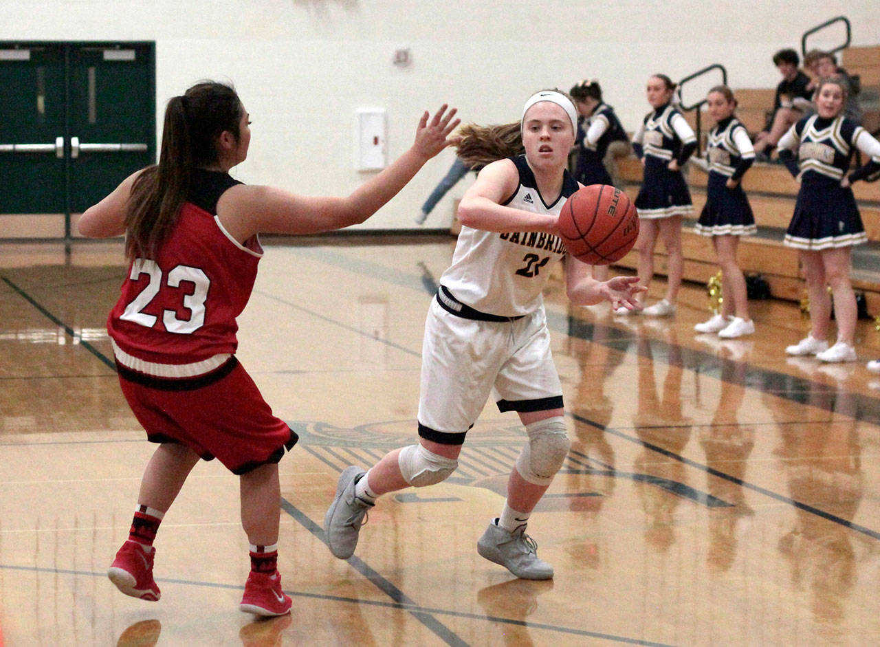 Luciano Marano | Bainbridge Island Review - Spartan freshman Anna Byers looks to make a pass around a Cleveland defender.