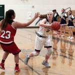Luciano Marano | Bainbridge Island Review - Spartan freshman Anna Byers looks to make a pass around a Cleveland defender.