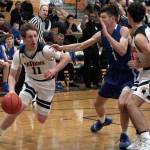 Luciano Marano | Bainbridge Island Review - Spartan senior Jackson Taylor drives around Seattle Prep defenders Tuesday. He led the teams scoring efforts, putting up 14 points against the Panthers.