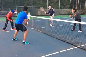 Tennis players crowd the courts on Bainbridge