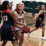 Island girls cap basketball season with win against Crusaders