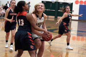 Island girls cap basketball season with win against Crusaders