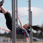Luciano Marano | Bainbridge Island Review - Bainbridge High Schools Kati Cooper strikes the bar in the pole vault event at the recent Logan Relays Jamboree track and field meet at BHS.