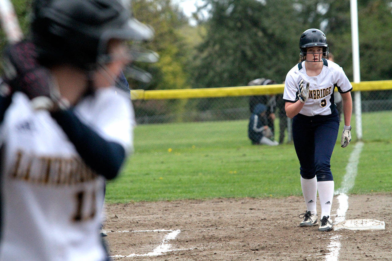 The Spartans Ellen Owen gets set to jet from third base with teammate Lillian McDonald at the plate. Owen scored on McDonalds two-out single against Nathan Hale. (Brian Kelly | Bainbridge Island Review)
