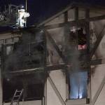 Luciano Marano | Bainbridge Island Review | A firefighter examines the roof of a Winslow Green condominium complex that caught fire Thursday, April 8. One person, an 81-year-old man, was killed.