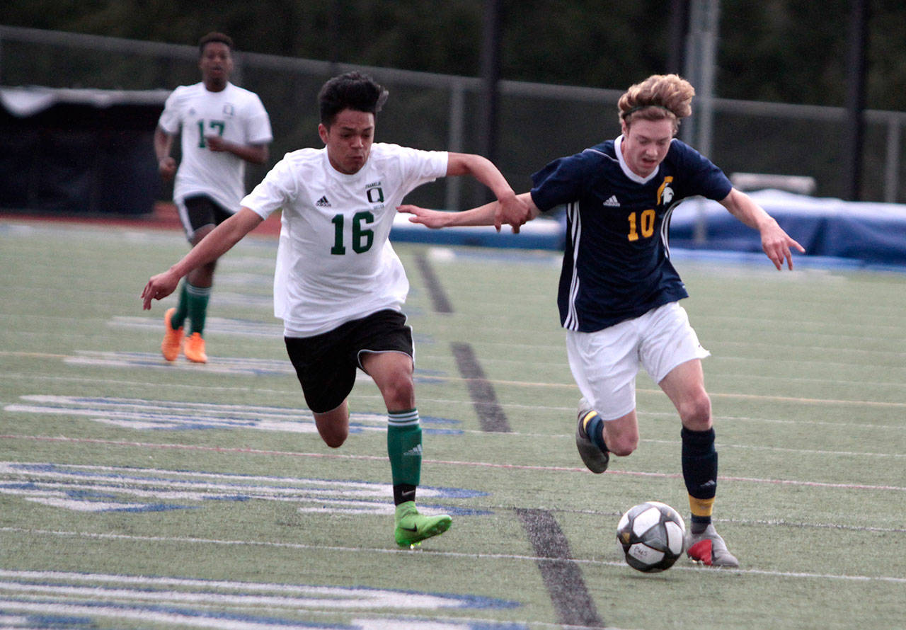 Luciano Marano | Bainbridge Island Review - Bainbridge High Schools Dustin Scott drives down the field during last weeks home match against Franklin.