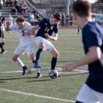 Luciano Marano | Bainbridge Island Review - Spartan freshman John Roman grapples for the ball during the recent Senior Night match against West Seattle.