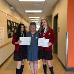 Photo courtesy of Susan Kilbane | Eighth graders Marlenne Ramirez and Myla Nover-Estes, with Saint Cecilia Catholic School teacher Amy Lee-Despard, winners of this years Law Day Essay Contest.