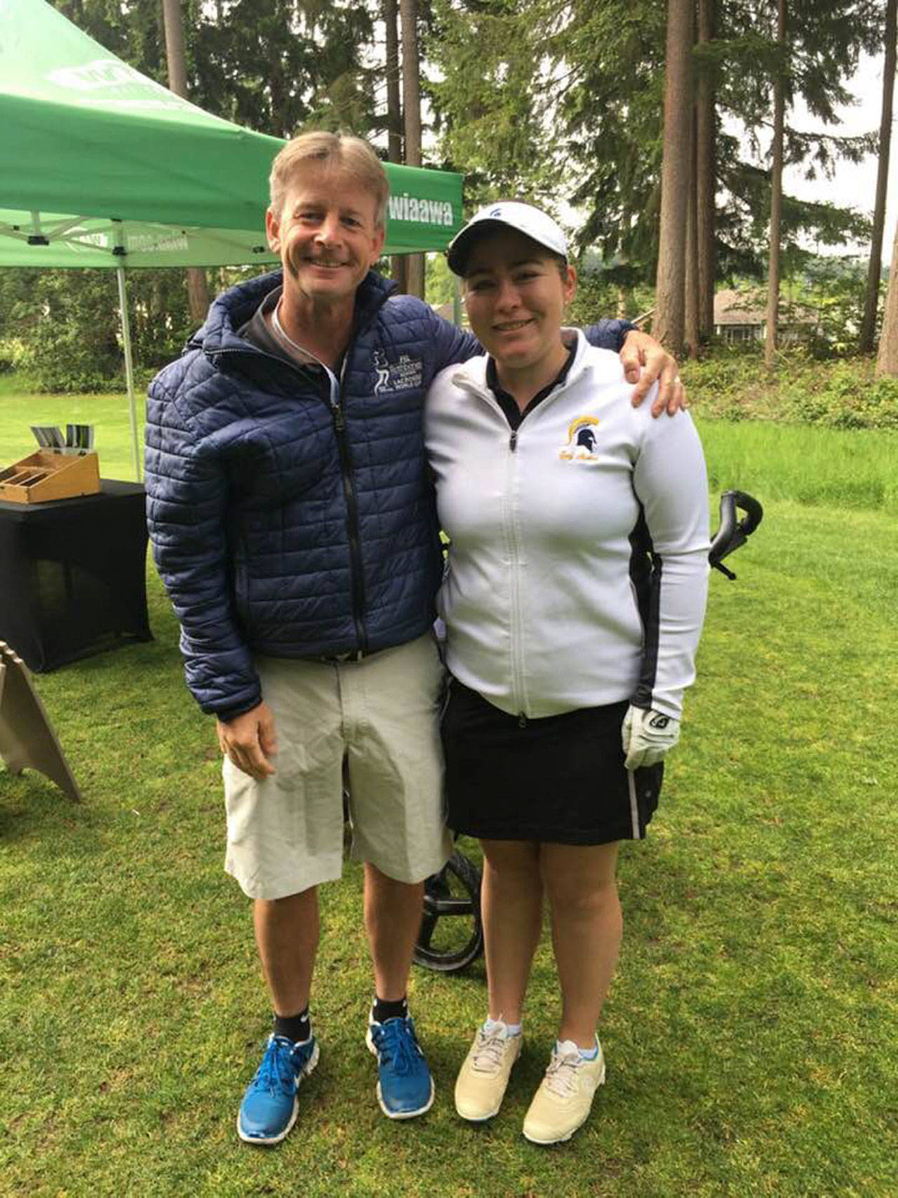 Margaret Hanacek photo | Bainbridge High School senior Lucy Hanacek poses with BHS girls golf team Head Coach Ian Havill after having placed 19th at the recent Washington Interscholastic Activities Association 3A Girls Golf State Championship.