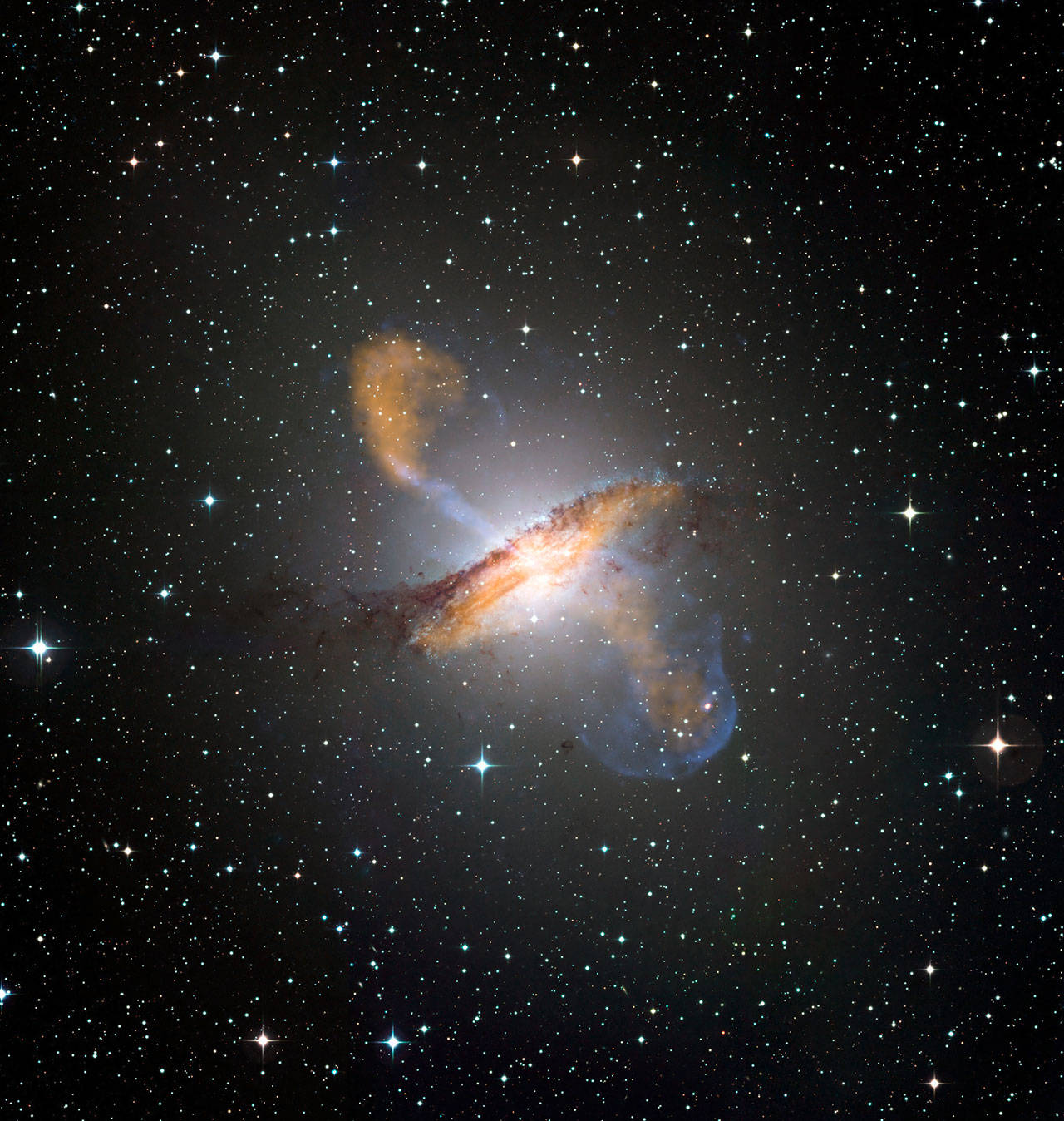 An image of Centaurus A, revealing the lobes and jets emanating from the active galaxys central black hole. (Photo courtesy of ESO/NASA)