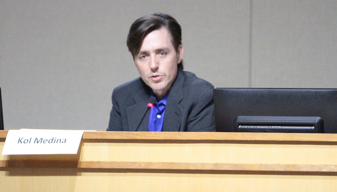 Commissioner Kol Medina explains his vote on the sale of the 550 Madison Apartments during the Housing Kitsap meeting Tuesday in Poulsbo. (Brian Kelly | Bainbridge Island Review)