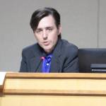 Commissioner Kol Medina explains his vote on the sale of the 550 Madison Apartments during the Housing Kitsap meeting Tuesday in Poulsbo. (Brian Kelly | Bainbridge Island Review)