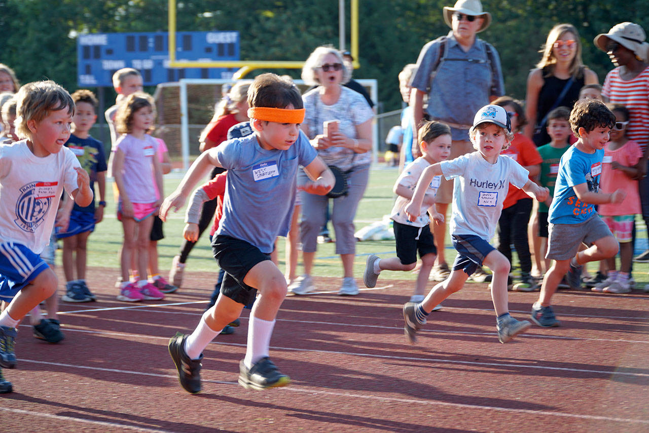 Luciano Marano | Bainbridge Island Review - West Schurtleff, 5, was rocking a sweet headband to help him beat the heat during Mondays Kiwanis All-Comers Track Meet at Bainbridge High School. He ultimately came in first in his age group in three seperate events.