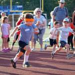 Luciano Marano | Bainbridge Island Review - West Schurtleff, 5, was rocking a sweet headband to help him beat the heat during Mondays Kiwanis All-Comers Track Meet at Bainbridge High School. He ultimately came in first in his age group in three seperate events.
