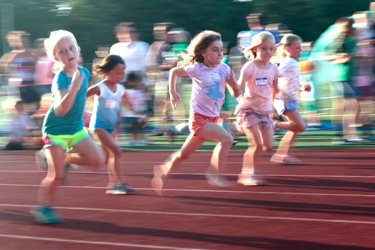 Luciano Marano | Bainbridge Island Review - A slew of speedy sprinters vie for an edge in the 60-meter dash event at the Kiwanis All-Comers Track Meet Monday, Aug. 5 at Bainbridge High School.