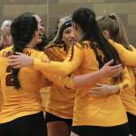 The Buccaneers huddle up during a timeout late in set three just before defeating Bainbridge in their opening match. (Mark Krulish | Kitsap News Group)