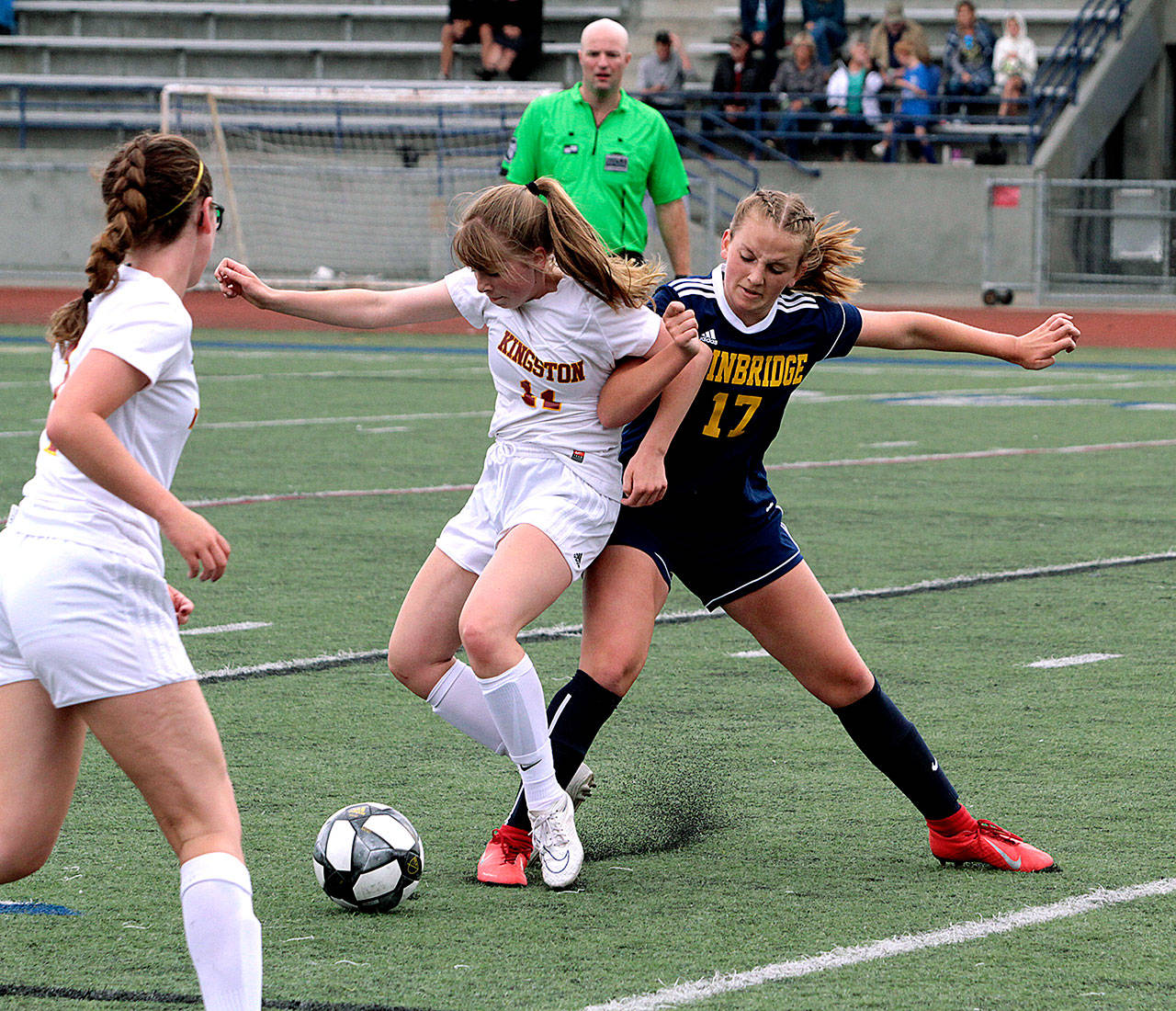 Bainbridge midfielder Samantha Batson makes a play for the ball during the Spartans opener against Kingston Saturday at BHS Memorial Stadium. (Brian Kelly | Bainbridge Island Review)